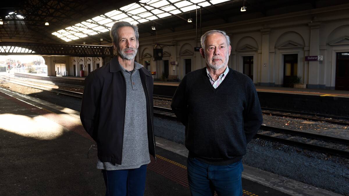 Get it done: Save Our Station's John Barnes and Gerald Jenzen say the Ballarat train station is being neglected, as evidenced by bits of wood and concrete falling off its facade (below). Pictures: Adam Trafford