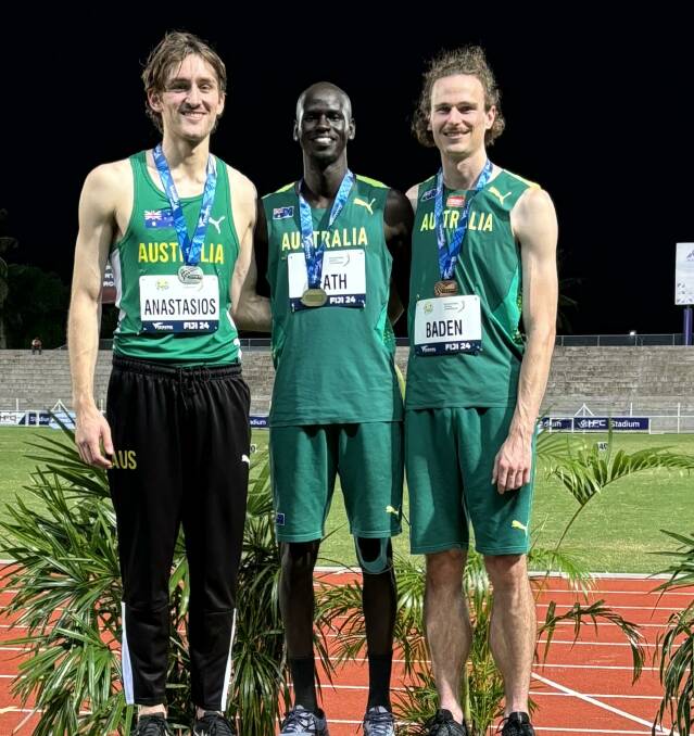 Yual Reath (centre) on the top of the podium at the Oceania Championships with Roman Anastasios and Joel Baden. Picture supplied