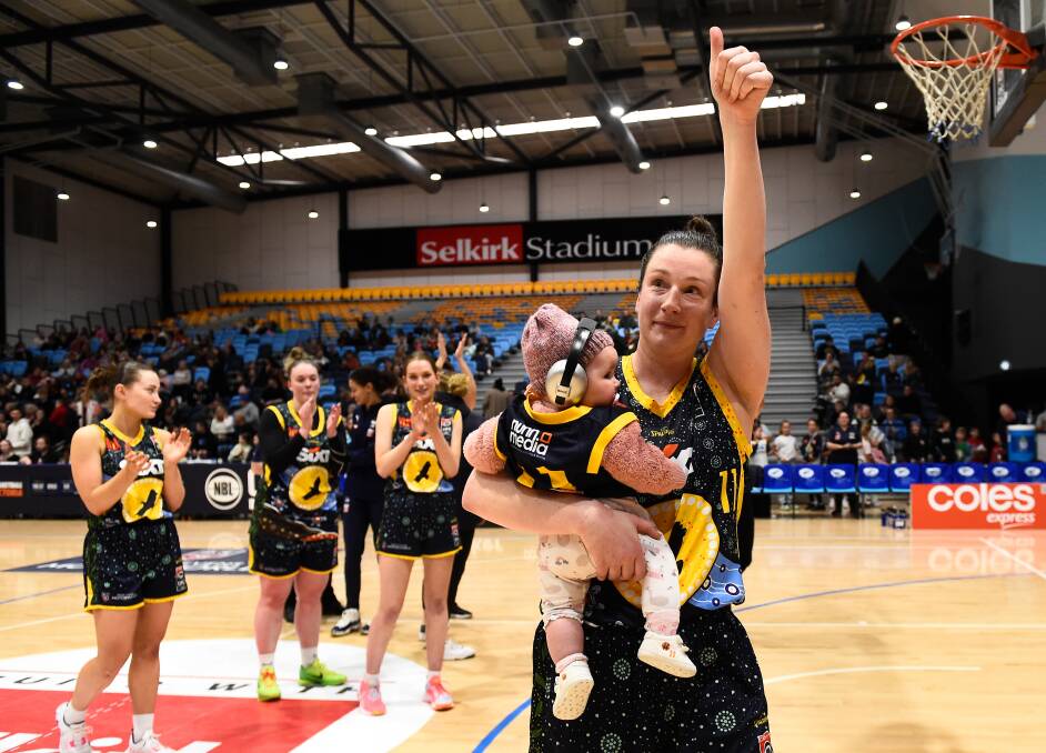Kristy Rinaldi, and daughter Frankie, wave farewell to her home crowd for the final time. Picture by Adam Trafford