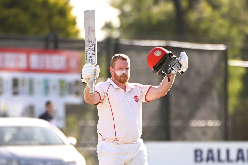 Heath Pyke raises the bat after bringing up his cenutry against Bacchus Marsh. Picture by Adam Trafford