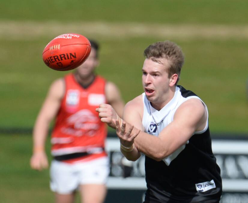 Josh Webster gets away a handball while playing with North Ballarat in the VFL in 2016. Picture by Kate Healy.