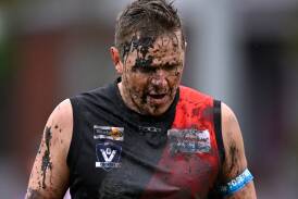 There would be no 300th game fairytale ending for Buninyong's muddied Jarrod Morgan as the Bombers went down to Daylesford at Buninyong on Saturday. Picture by Adam Trafford.