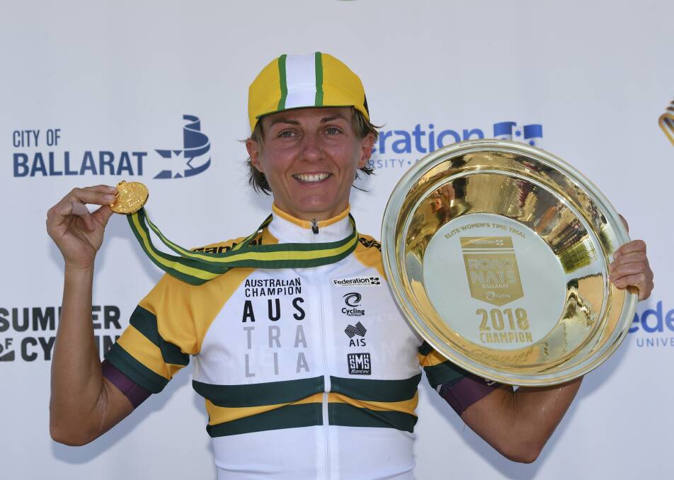 THREE-TIMES: Katrin Garfoot with her championship jersey, gold medal and gold pan trophy after a third win in the elite women's time trial. Picture: Lachlan Bence  