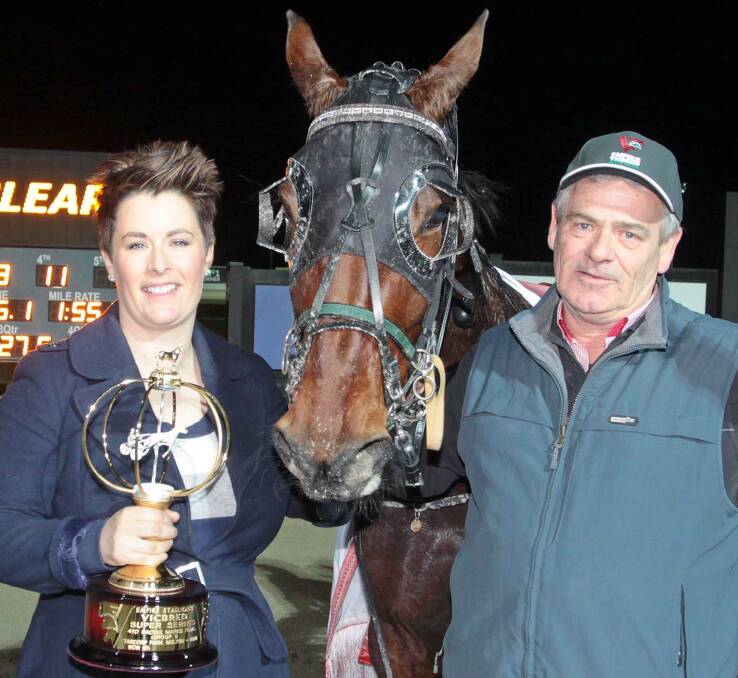 DELIGHTED: Trainer Emma Stewart and her father Warren Stewart with outstanding 4yo mare Delight Me, which raced three wide and outside the leader before landing her group 1 success. Pictures: Harness Racing Victoria.  