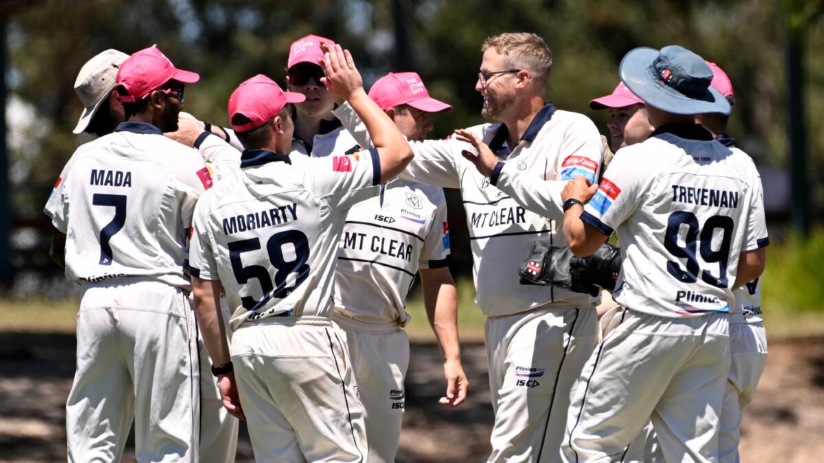 Mt Clear celebrates one of Ash George's five wickets in a match-winning performanace against East Ballarat at Russell Square. Picture by Adam Trafford.