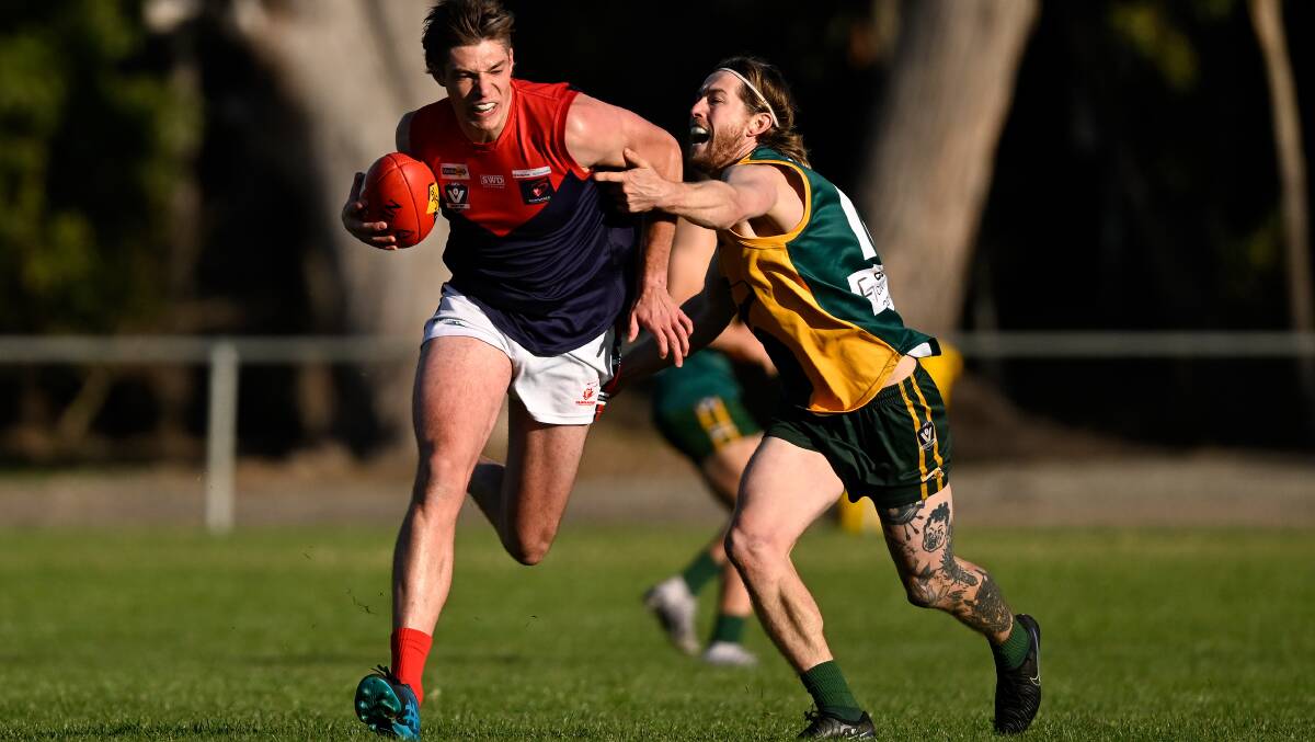 Isaac Quick (Bungaree) tries to shrug off an Ethan Crackel tackle at Gordon on Saturday. Picture by Adam Trafford.