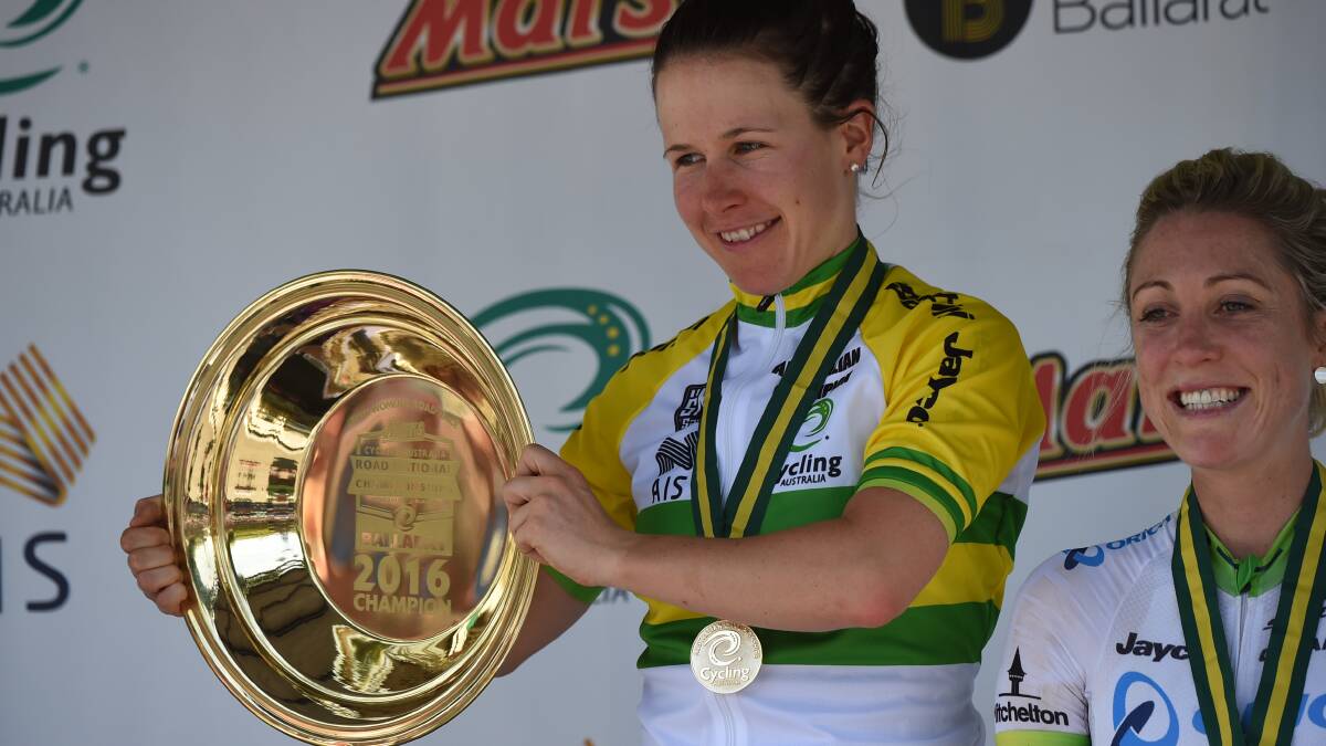 GOLD: Amanda Spratt shows off the distinctive gold pan trophy, which goes to all national road champions in Ballarat. Picture: Lachlan Bence