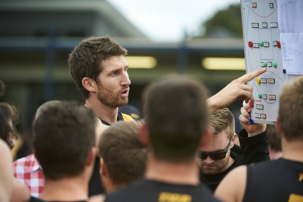 TALKING TACTICS: Michael Searl delivers a quarter-time address during his time as Springbank coach. 