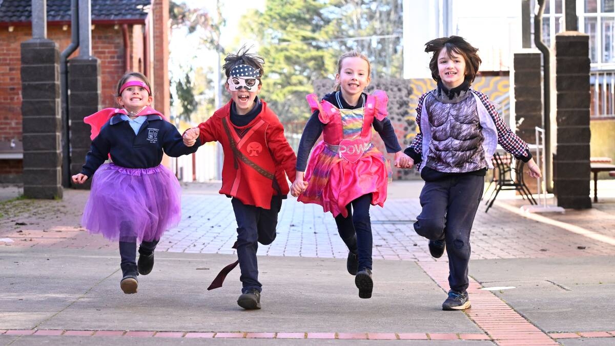 Ava, Carter, Ellena and Saul model some of the costumes available at the school's first Book Week costume swap. Picture by Adam Trafford