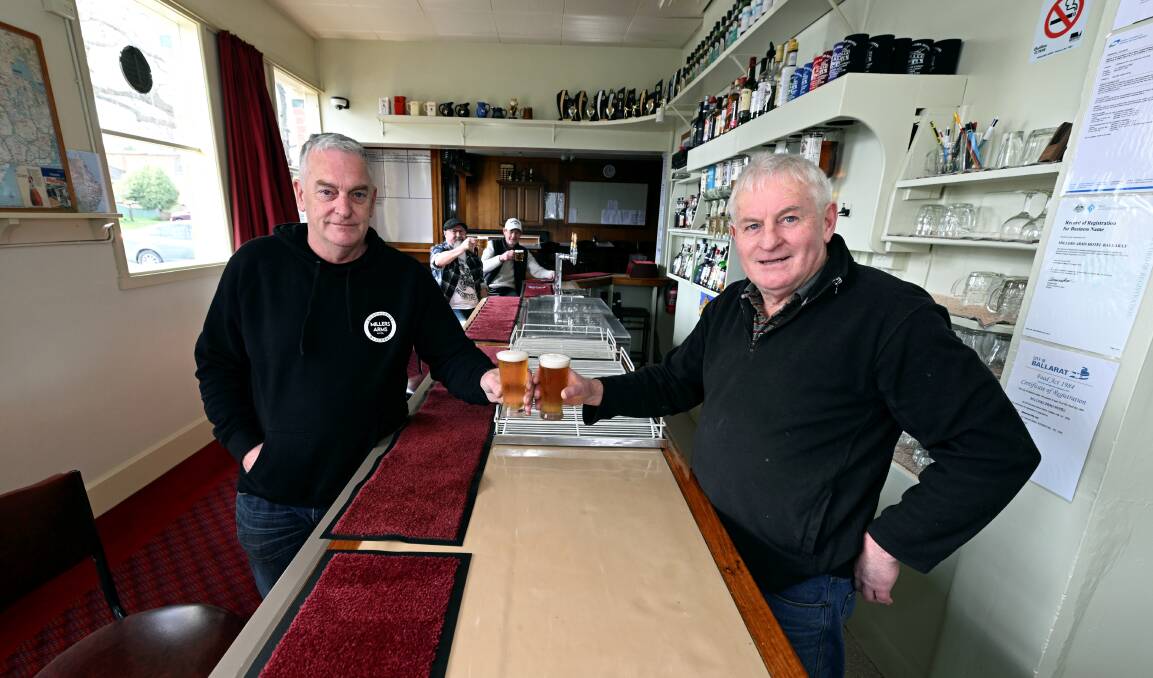 Millers Arms Hotel owner Darryl Stewart (right) spends his last days behind the bar of the Doveton Street pub before new owner Brett Aspland (left) takes over on August 28. Picture by Lachlan Bence