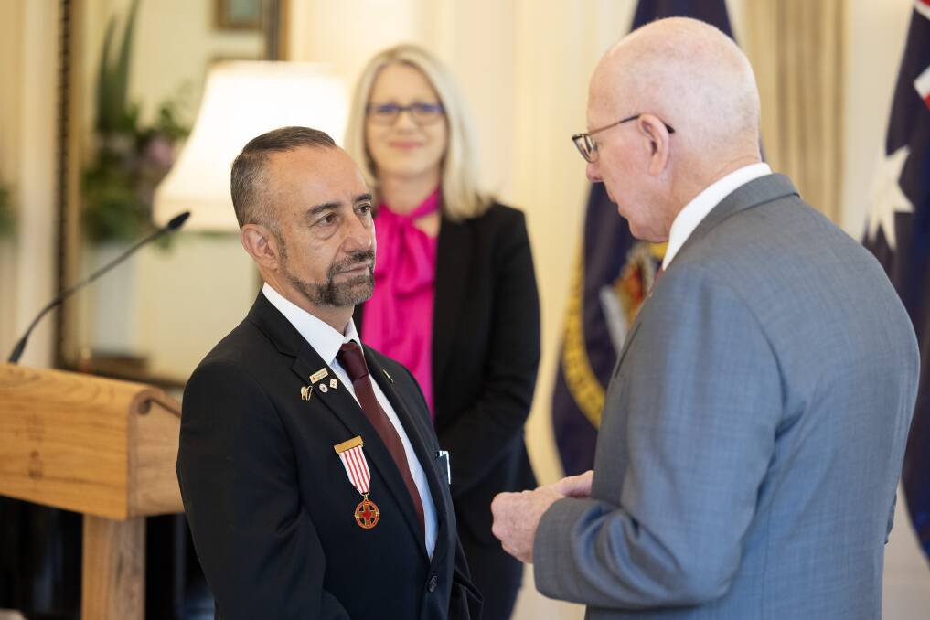 Nick Prince receives the Florence Nightingale Medal from Australia's Governor General David Hurley. Picture supplied