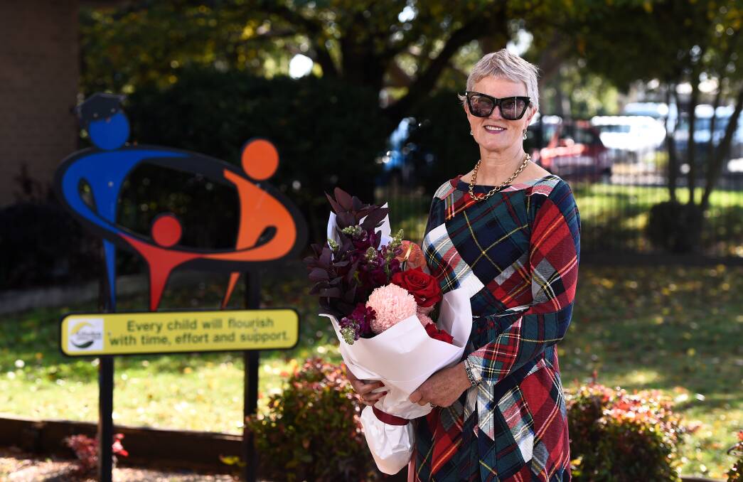 Alfredton Primary School principal Laurel Donaldson with flowers she received to mark her 40 years with the with the Victorian education department. Picture by Adam Trafford