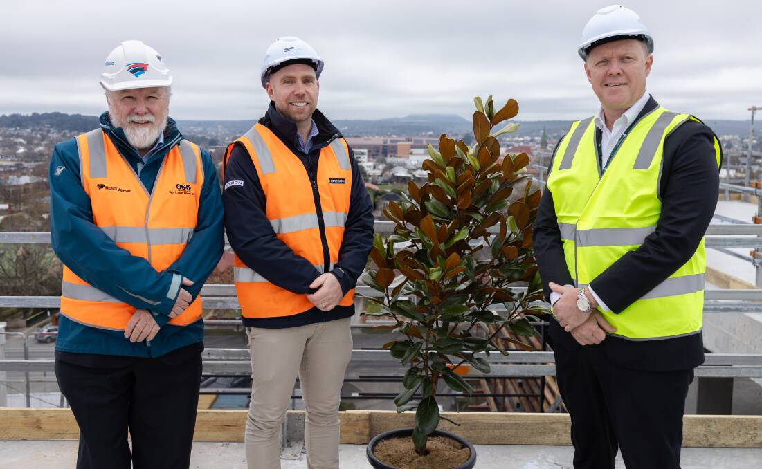 Besix Watpac operations manager Matthew Dalmau, H.Troon director James Troon and St John of God Ballarat Hospital chief executive Alex Demidov celebrate completion of the structure of the new SJOG building. Picture supplied