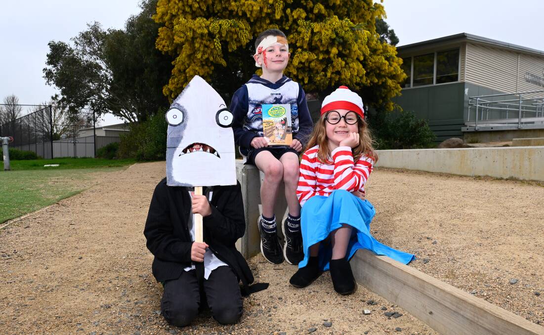 Archie as Mr Shark of the Bad Guys, Gus as Joel Selwood of The Selwood Boys and Indi as Wanda of Where's Wally are excited for Book Week at Miners Rest Primary School. Picture by Adam Trafford