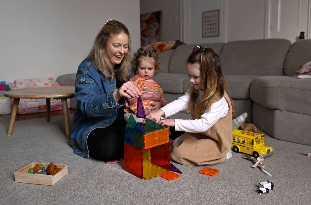 Play therapist and Deakin University lecturer Bridget Sarah plays with daughters Maeve, 17 months, and Vivienne, 3, on the eve of the inaugural UN International Day of Play. Picture by Adam Trafford
