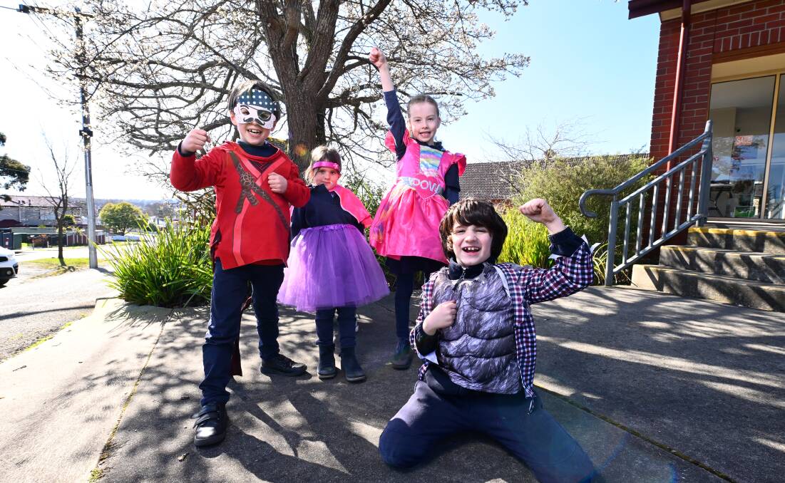 Carter, Ava, Ellena and Saul get ready for Mount Pleasant Primary School's book week parade with a costume swap that is set to expand to serve all Ballarat families next year. Picture by Adam Trafford