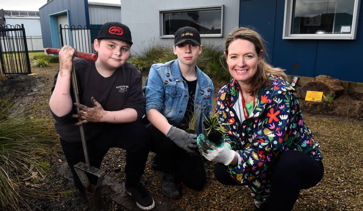 Berry Street School students Lane and Mason with teacher Nadine Ogilvie during National Schools Tree Planting Day activities. Picture by Adam Trafford