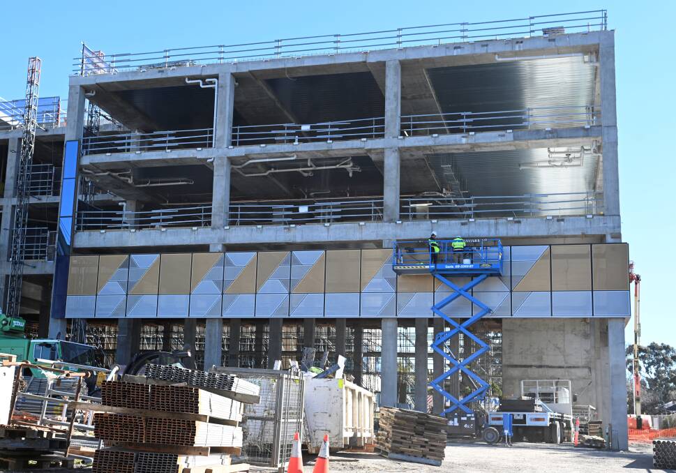 The facade of the new St John of God hospital building starts to go up. Picture by Lachlan Bence