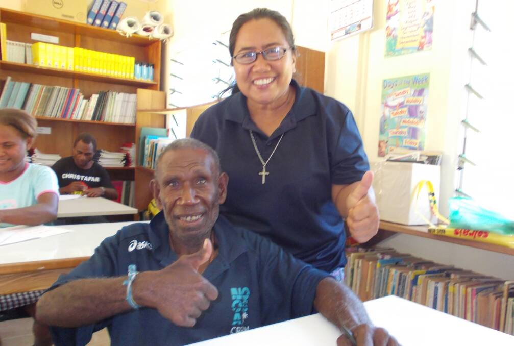 Sr Maria Fe Rollo and a class member at San Isidro Care Centre in the Solomon Islands capital of Honiara. Picture: supplied