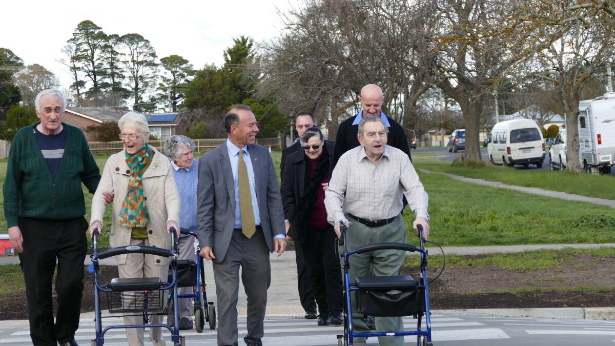 Buninyong MP Geoff Howard and Ballan residents using the town's new pedestrian crossing. 