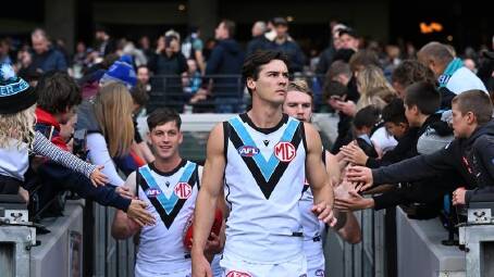 Port Adelaide captain Connor Rozee (centre) is a certain starter against Adelaide. (James Ross/AAP PHOTOS)