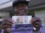 Zimbabwe has started distributing Zig banknotes and coins after introducing the currency in April. (AP PHOTO)