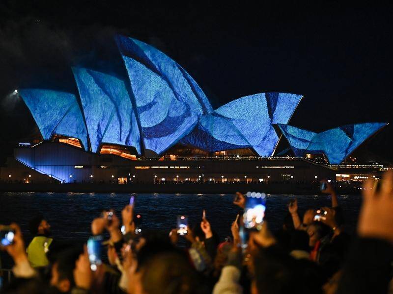 People lined Sydney Harbour for Vivid's drone show, with the number of people causing concern. (Steven Saphore/AAP PHOTOS)