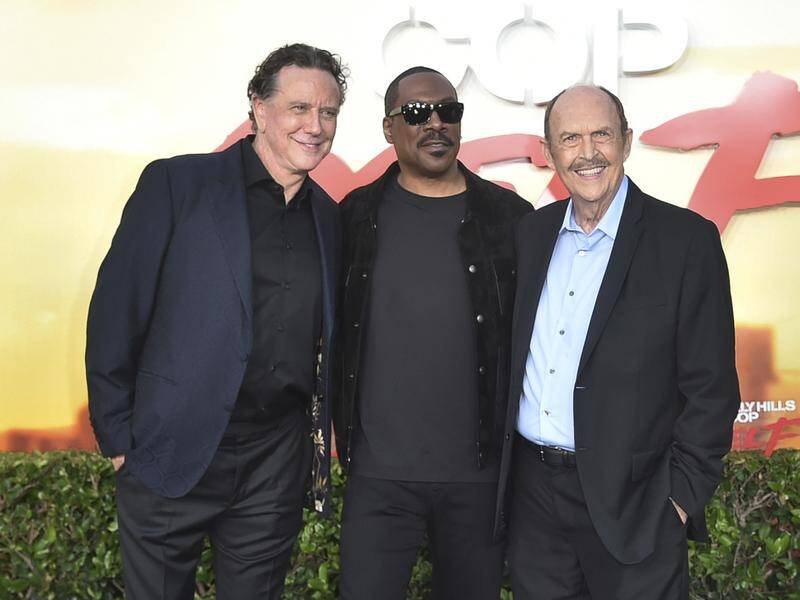 Fellow original cast members Judge Reinhold and John Ashton joined Eddie Murphy at the premiere. (AP PHOTO)