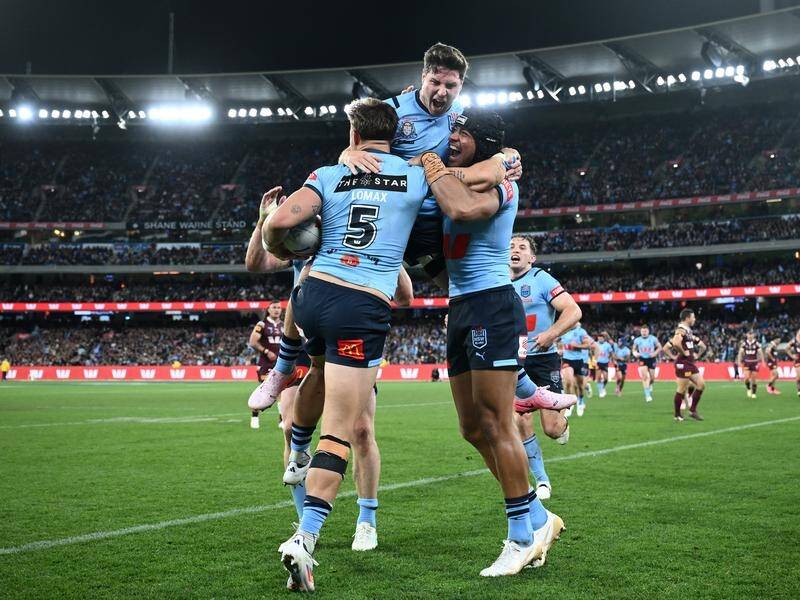 Mitchell Moses (top centre) had a barnstorming game for NSW in their 38-18 win over Queensland. (Joel Carrett/AAP PHOTOS)