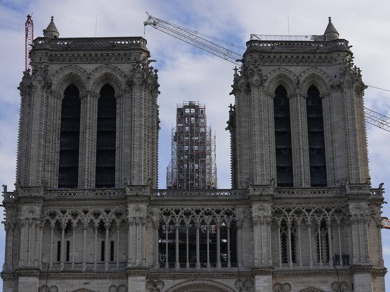 The spire of Notre Dame cathedral is identical to the previous one, which collapsed in the 2019 fire (AP PHOTO)
