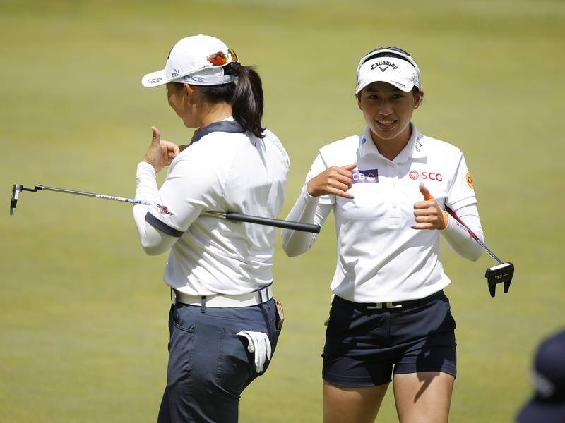Atthaya Thitikul (R) and teammate Ruoning Yin on their way to victory at the Dow Championship. (AP PHOTO)