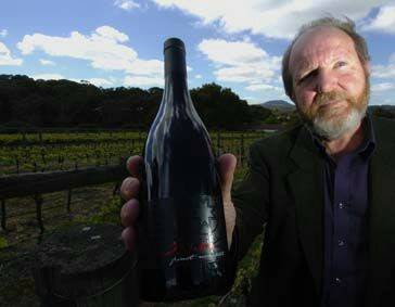GREAT COMPANION: Ballarat winemaker Ian Watson with his award-winning Tomboy Hill pinot noir. Picture: Jeremy Bannister